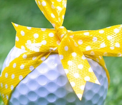 bow on golf ball on golf greens